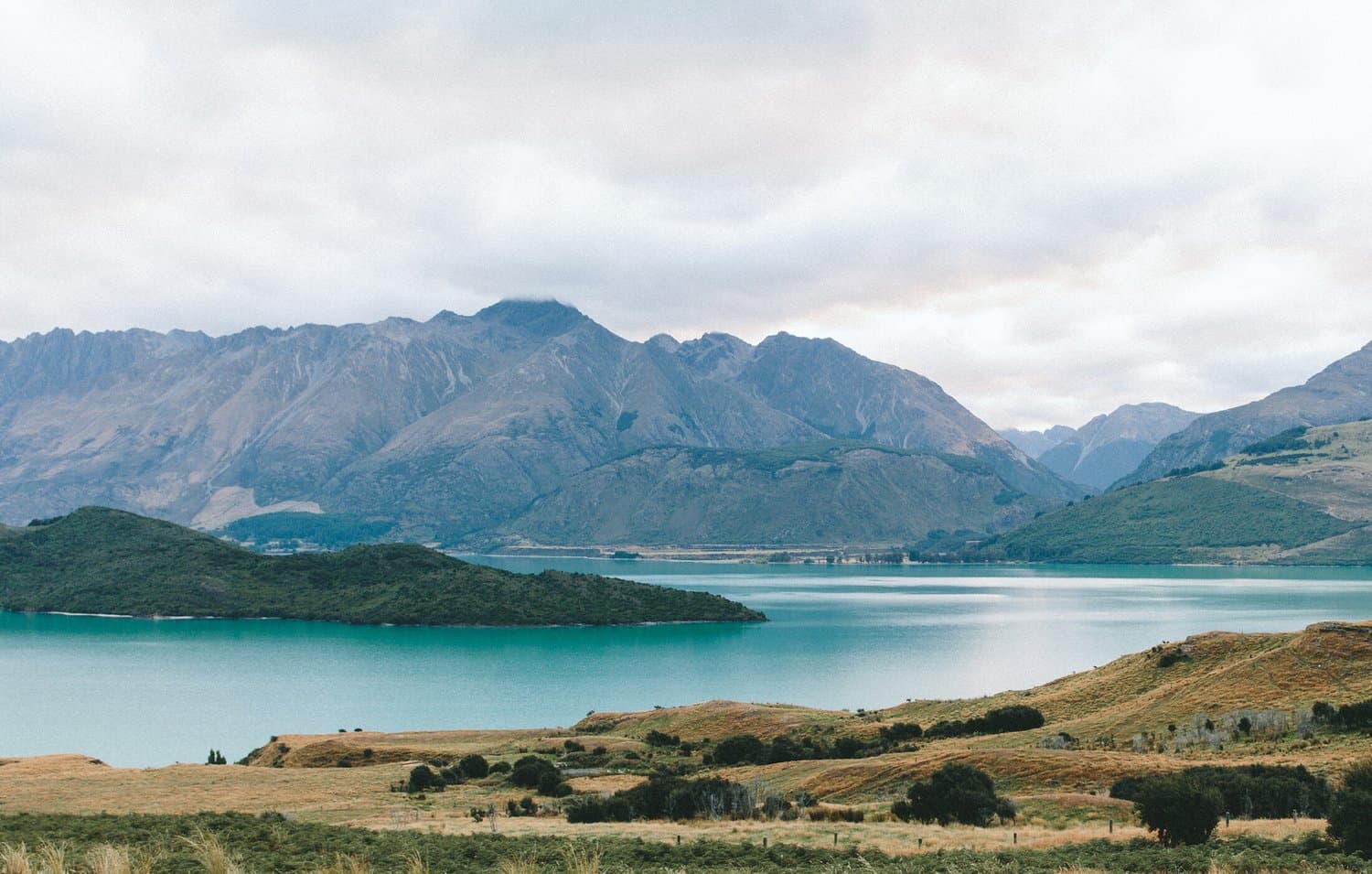 Mountains rising above a turquoise alpine lake