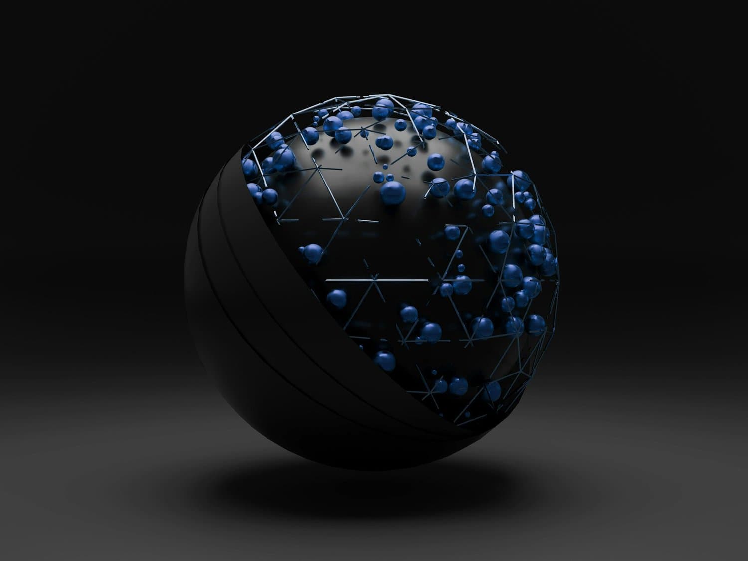 Rendered dark sphere wrapped in a network of glowing blue nodes